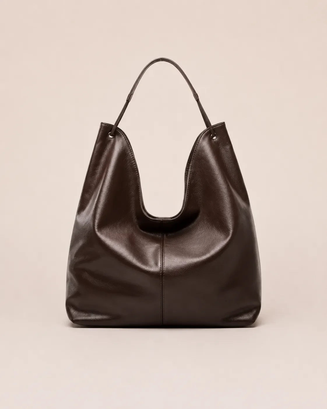 Front view of the Colette dark chocolate leather hobo tote bag crafted from genuine leather with a soft silhouette and spacious everyday design.