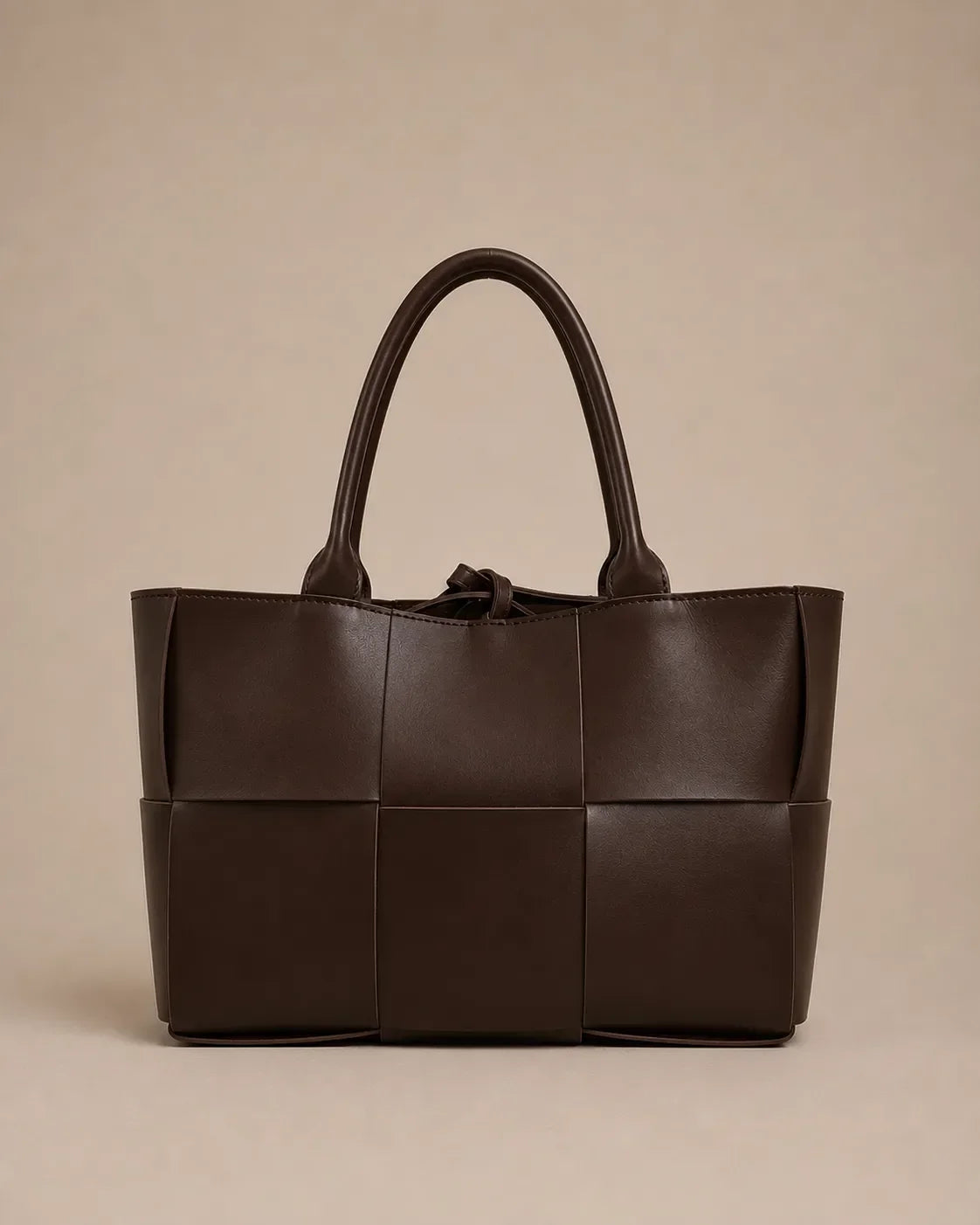 Front view of the Florence woven leather tote bag crafted from genuine chocolate brown leather.