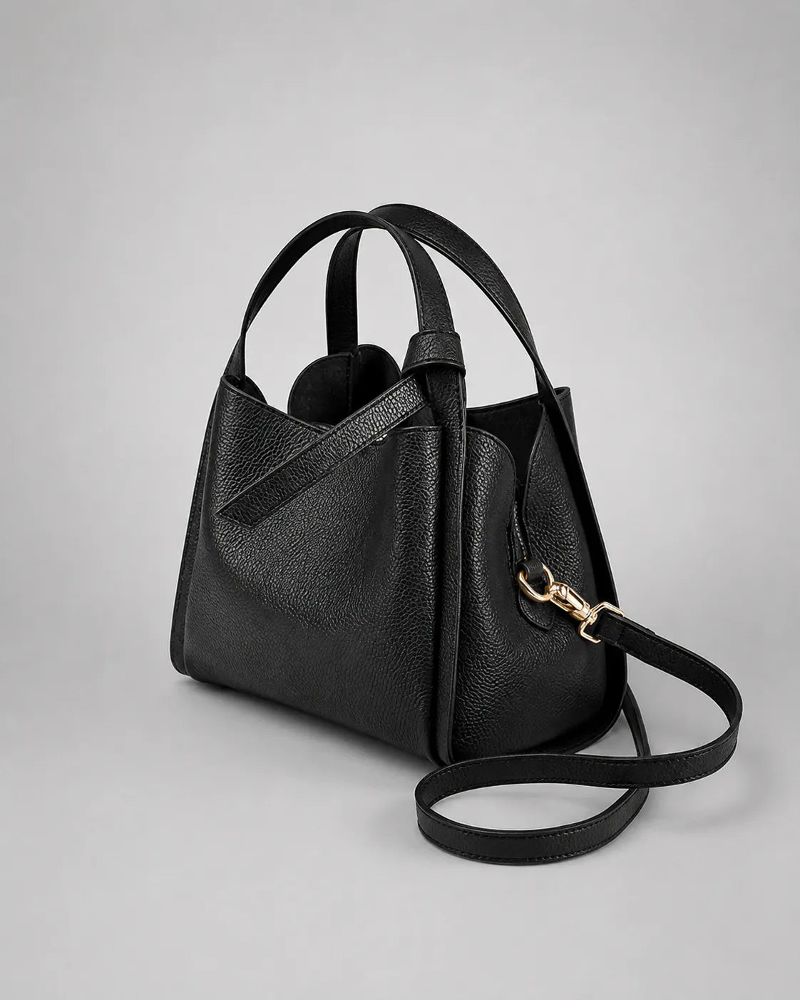 Angled front view of the Amelia Leather Tote Bag in Black genuine leather showcasing its structured shape and versatile design.