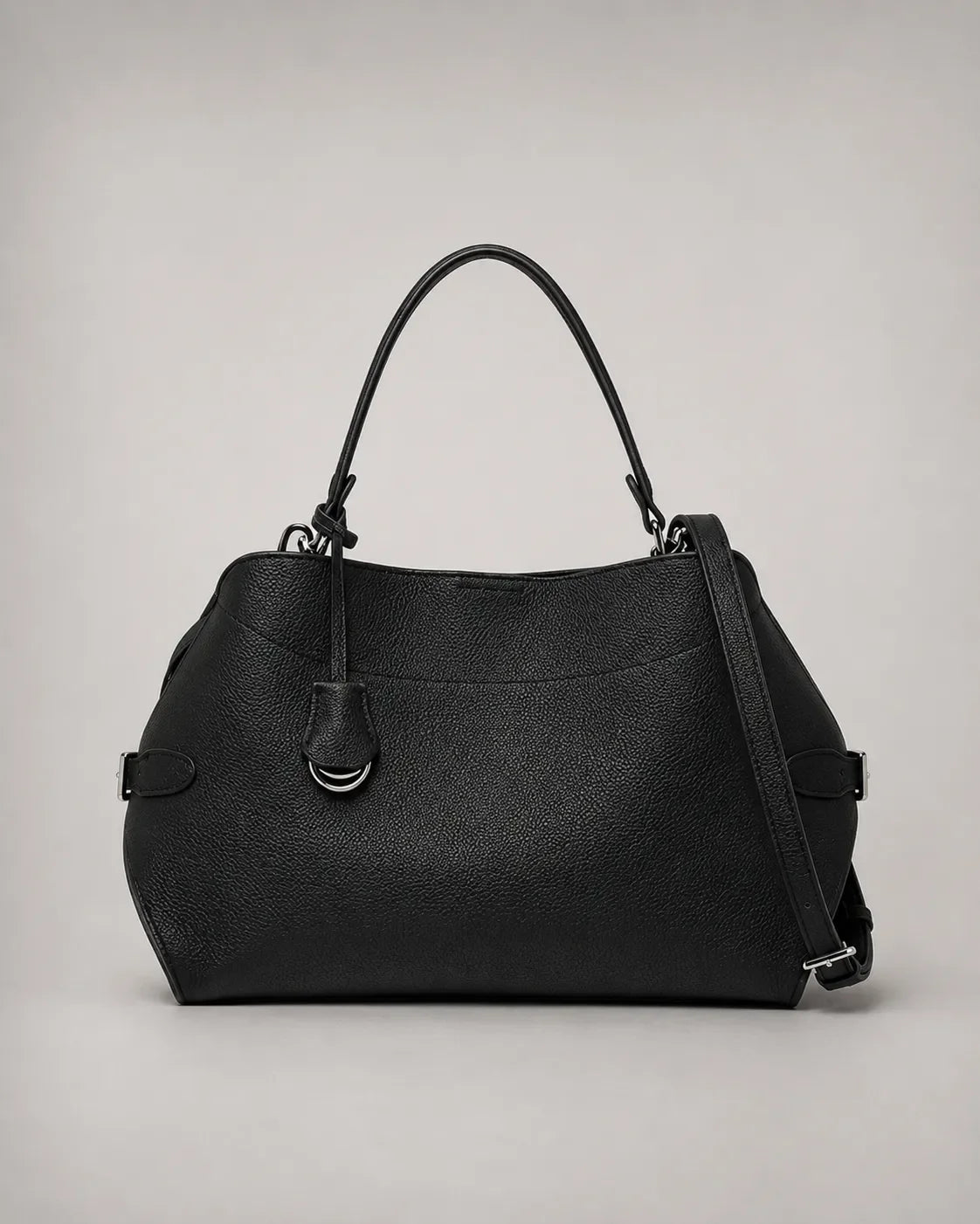 Front view of the Eliza genuine leather shoulder bag in Black featuring a softly structured silhouette, removable shoulder strap, adjustable crossbody strap, silver-tone hardware and premium pebbled leather by Malena London.