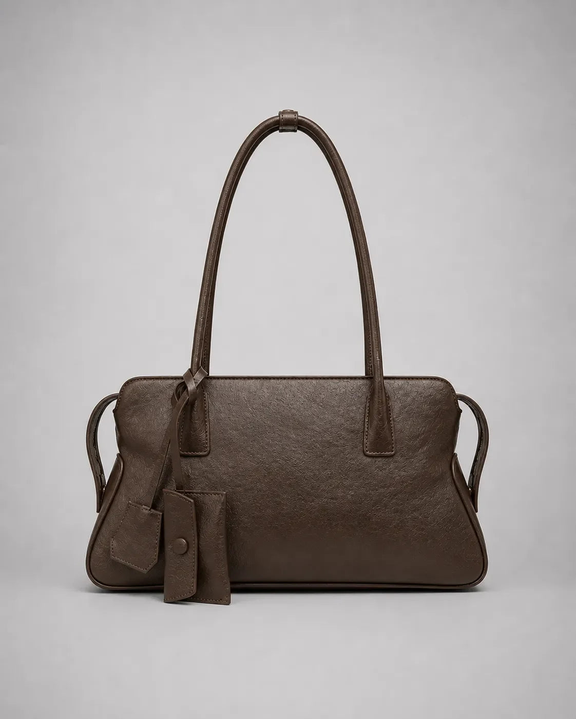 Georgia leather shoulder bag in Dark Chocolate genuine leather front view featuring a soft structured silhouette, double shoulder straps, decorative leather charms and zip-top closure from the Soft Structure collection by Malena London.