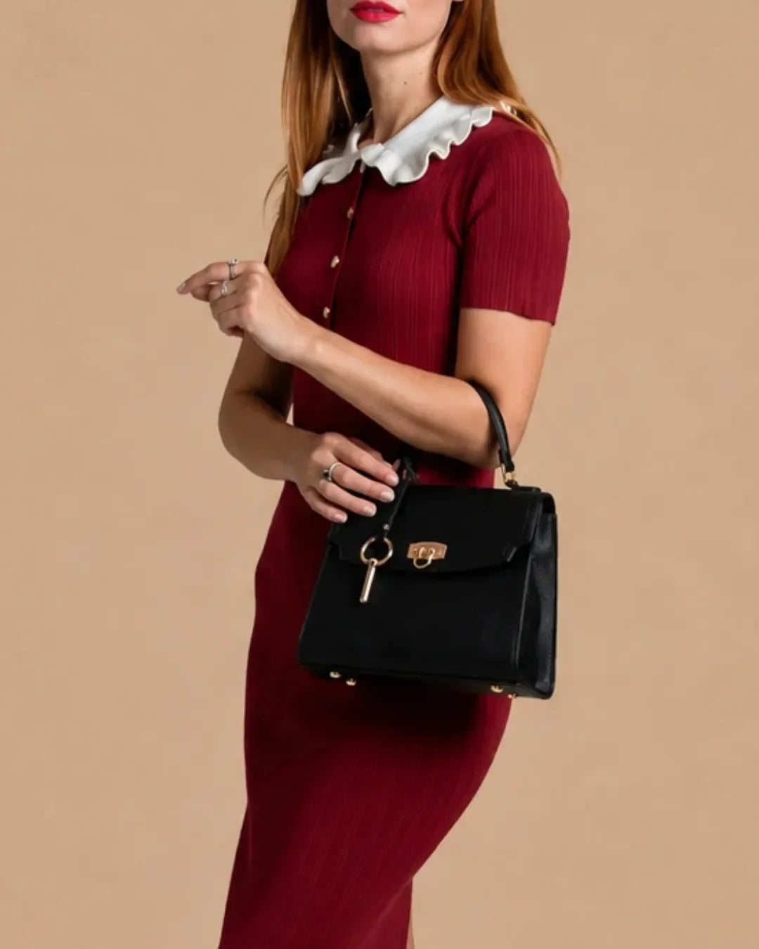 Model wearing The Beatrice genuine leather shoulder bag, highlighting its refined structured silhouette, premium top-grain leather, signature turn-lock closure and timeless everyday elegance.