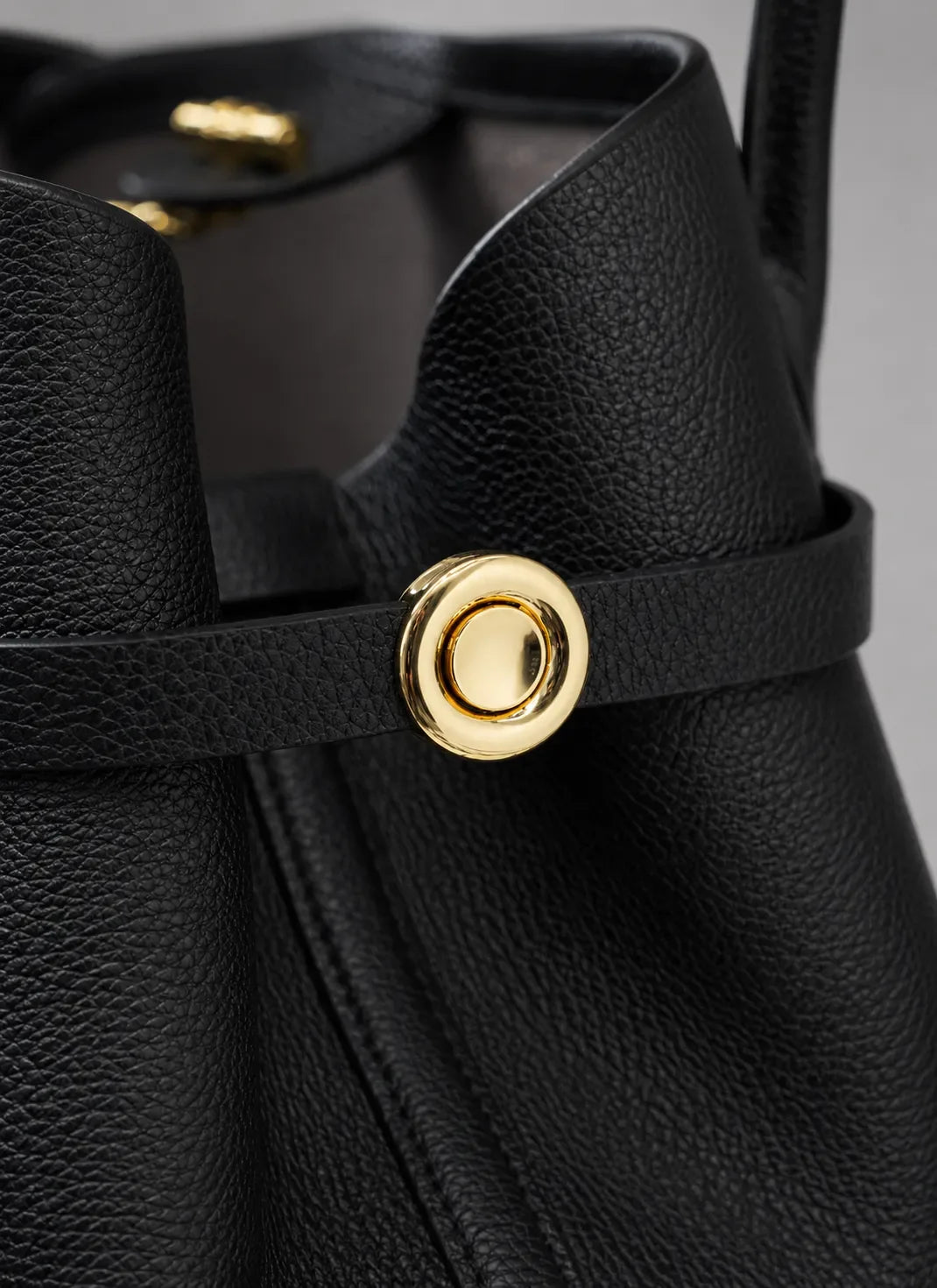 Close-up detail of the Rose Leather Tote Bag in Black genuine leather featuring refined gold-tone hardware and premium pebbled leather texture.