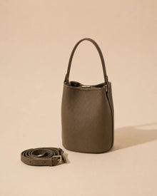 Front view of the Bonnie genuine leather bucket bag in Dark Grey featuring a compact bucket silhouette, soft structure and adjustable leather strap