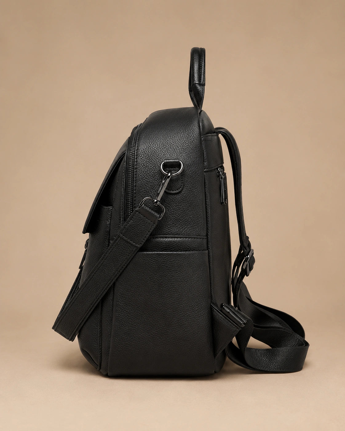 Interior view of the Sloane leather backpack showing the main compartment and organiser pockets.
