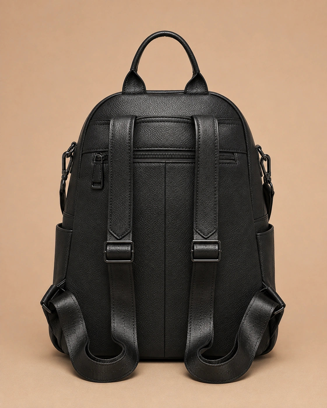 Detail view of the Sloane leather backpack's hidden back pocket.