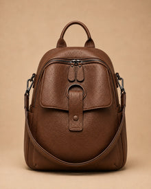 Side view of the Sloane leather backpack highlighting the compact structured shape.