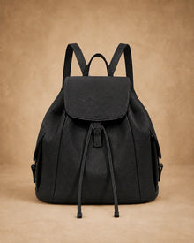 Front view of the Genevieve large genuine leather backpack showing the spacious silhouette.