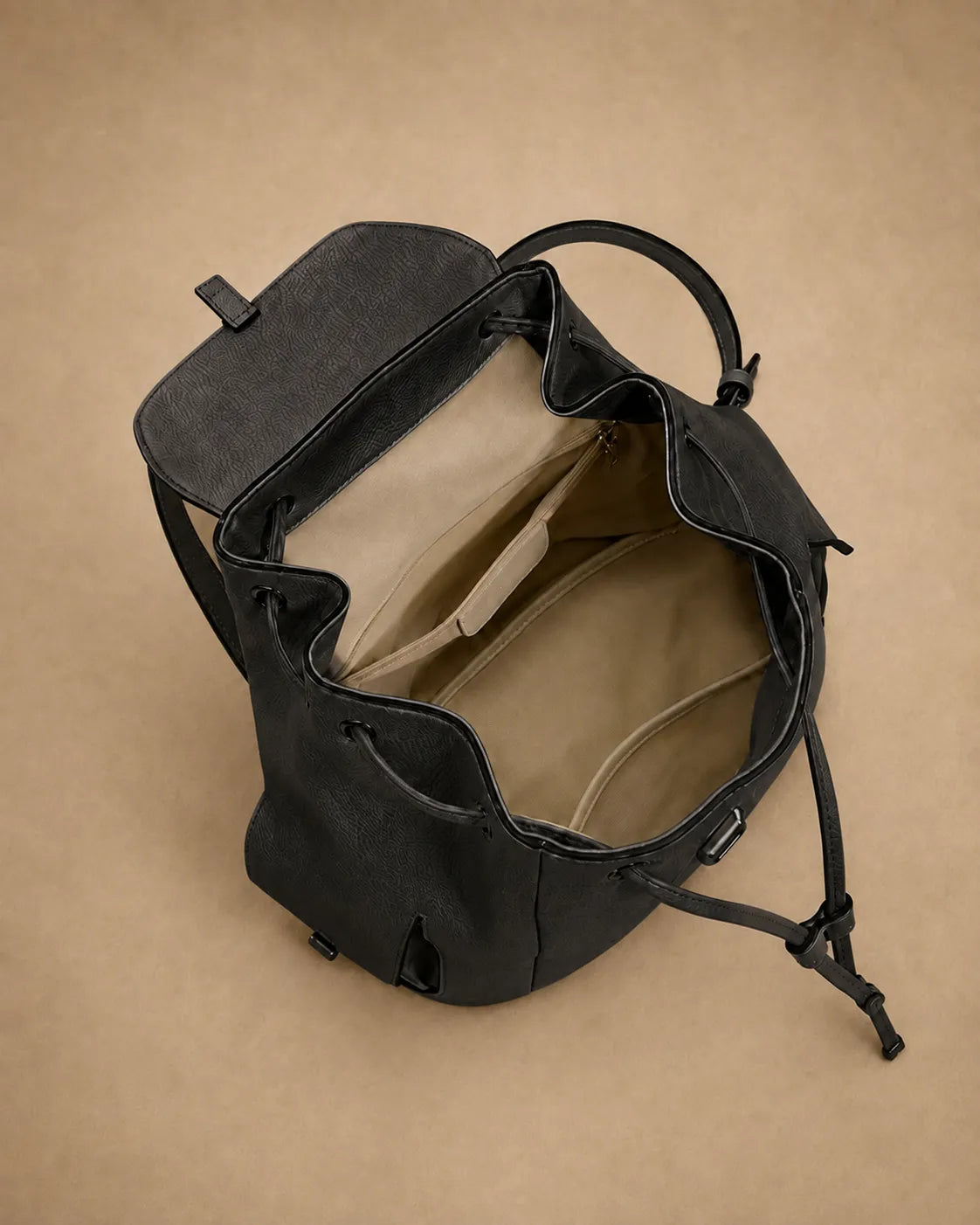 Detail view of the Genevieve leather backpack's phone pocket and ID pocket.