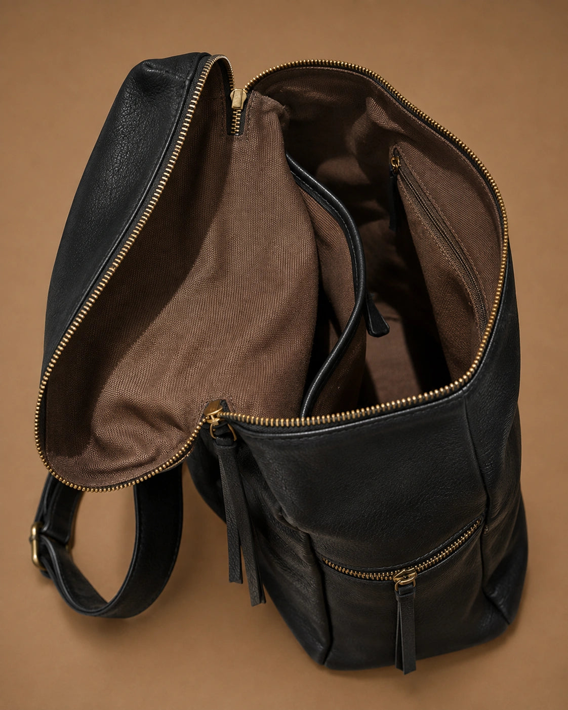 Detail view of the Adeline leather backpack's front pocket.