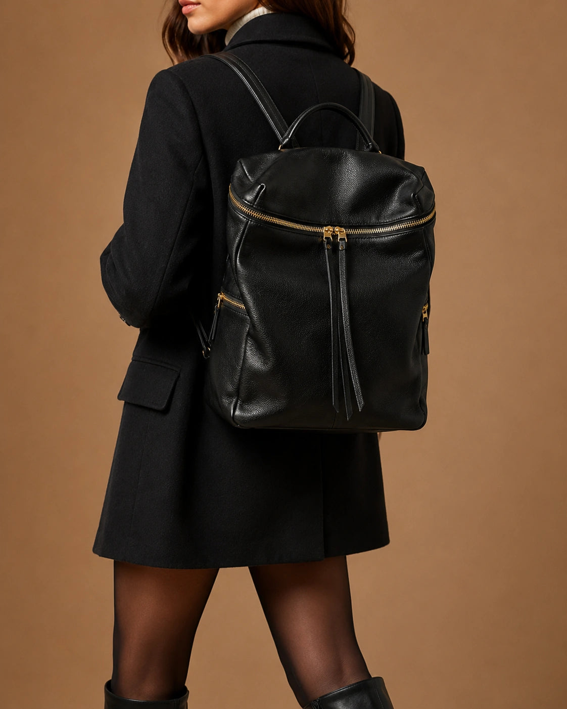 Interior view of the Adeline leather backpack showing the zipper pocket and ID pocket.