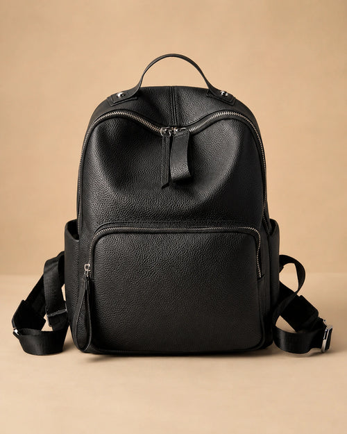 Front view of the Josephine genuine leather backpack showing the structured commuter silhouette.