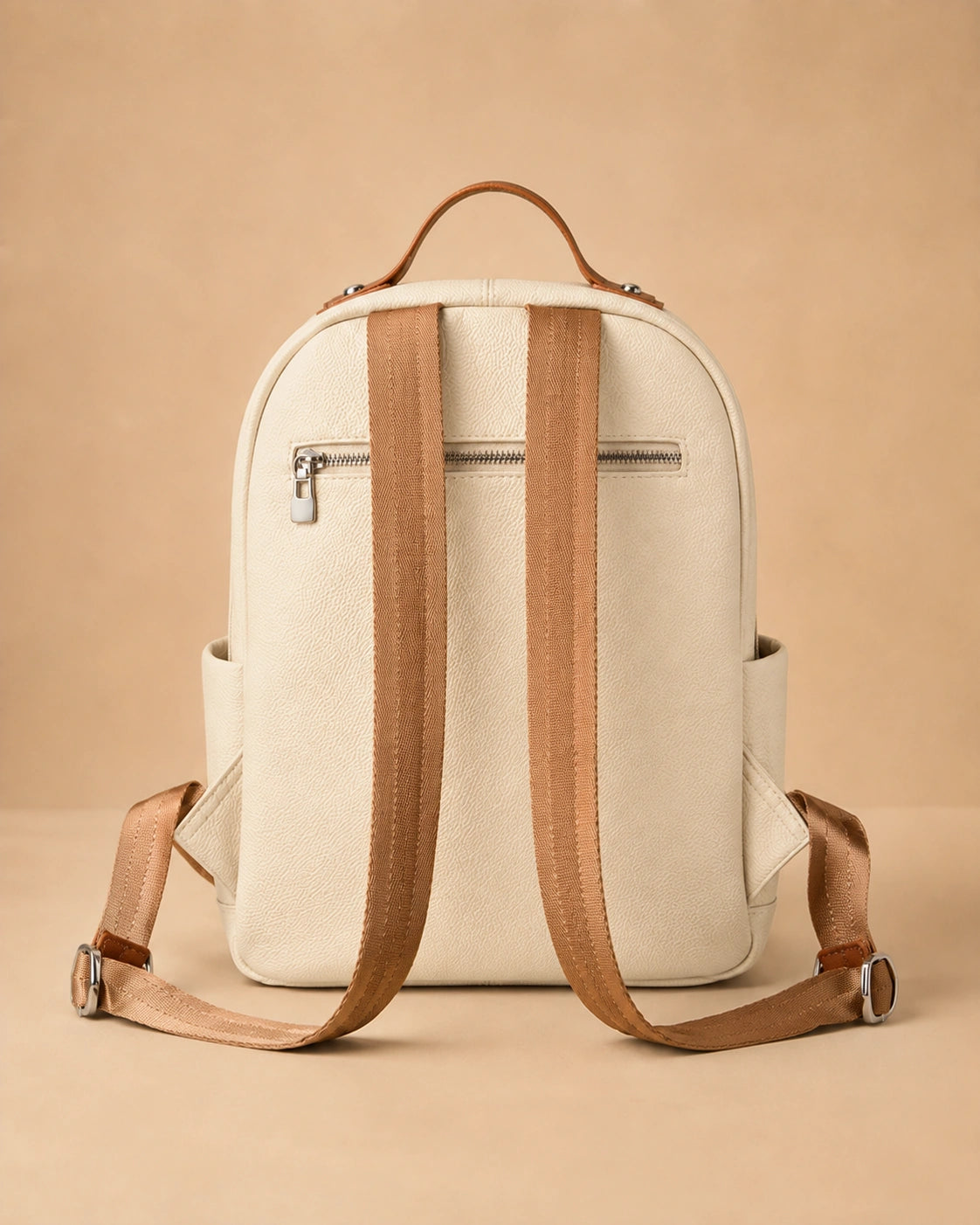 Detail view of the Josephine leather backpack's front pocket.