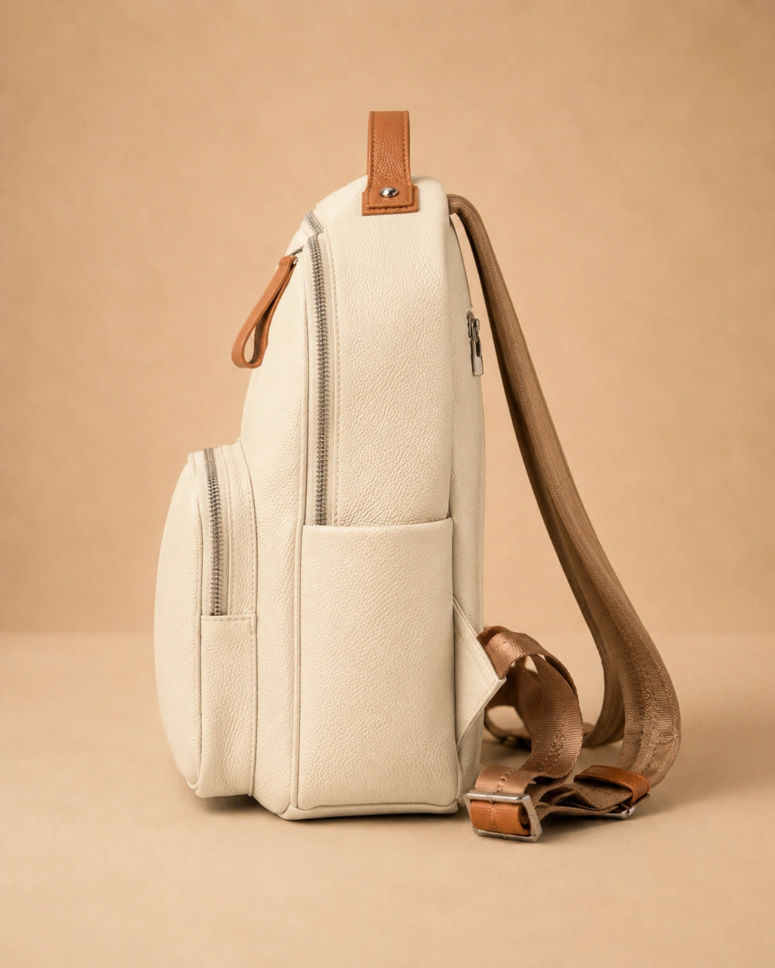 Josephine leather backpack shown holding an iPad Mini and A4 documents.