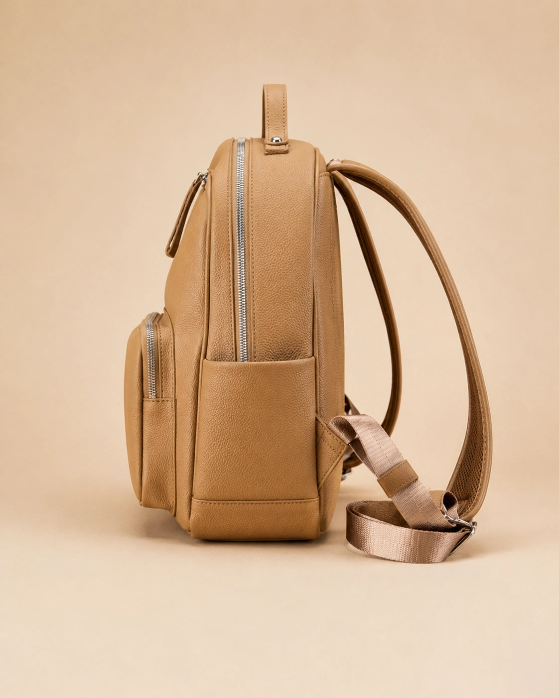 Detail view of the Josephine leather backpack's hardware.
