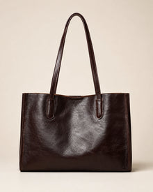 Angled front view of the Juliette large genuine leather tote bag in dark chocolate