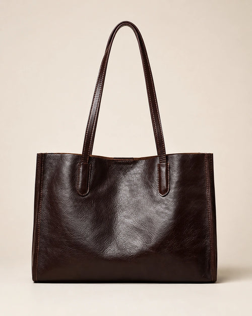 Angled front view of the Juliette large genuine leather tote bag in dark chocolate
