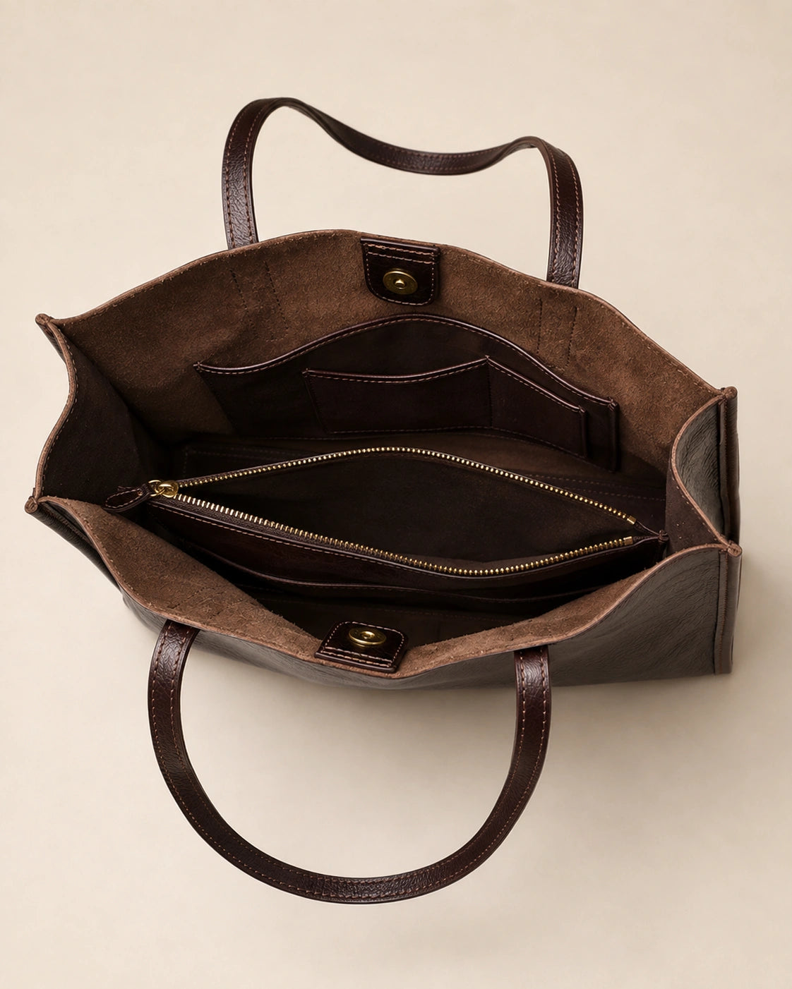 Interior view of the Juliette large genuine leather tote bag in dark chocolate, showing the zipped pocket and phone pocket