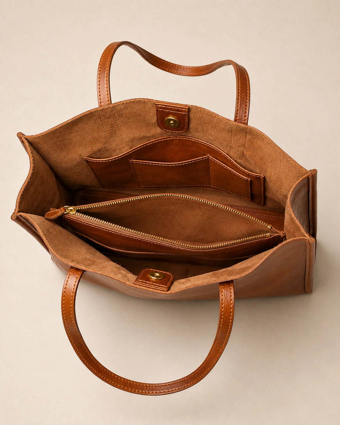 Interior view of the Juliette large genuine leather tote bag in tan, showing the zipped pocket and phone pocket