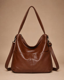 Front view of the Marlowe genuine leather crossbody bag showing the structured vertical silhouette.
