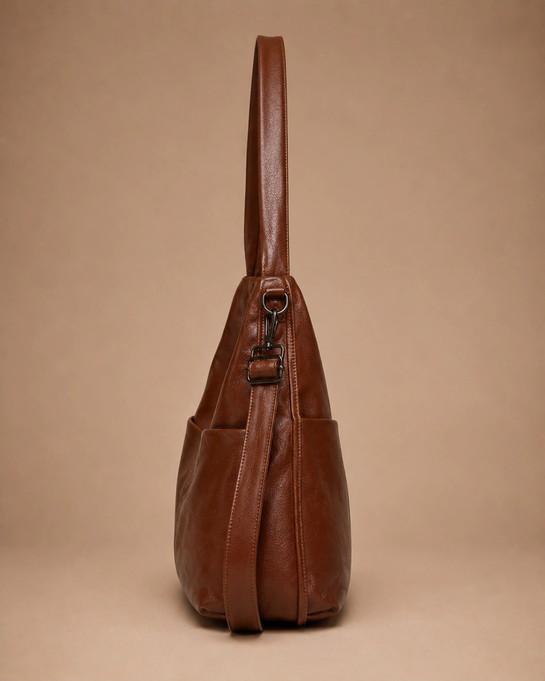 The Marlowe genuine leather crossbody bag worn over the shoulder.