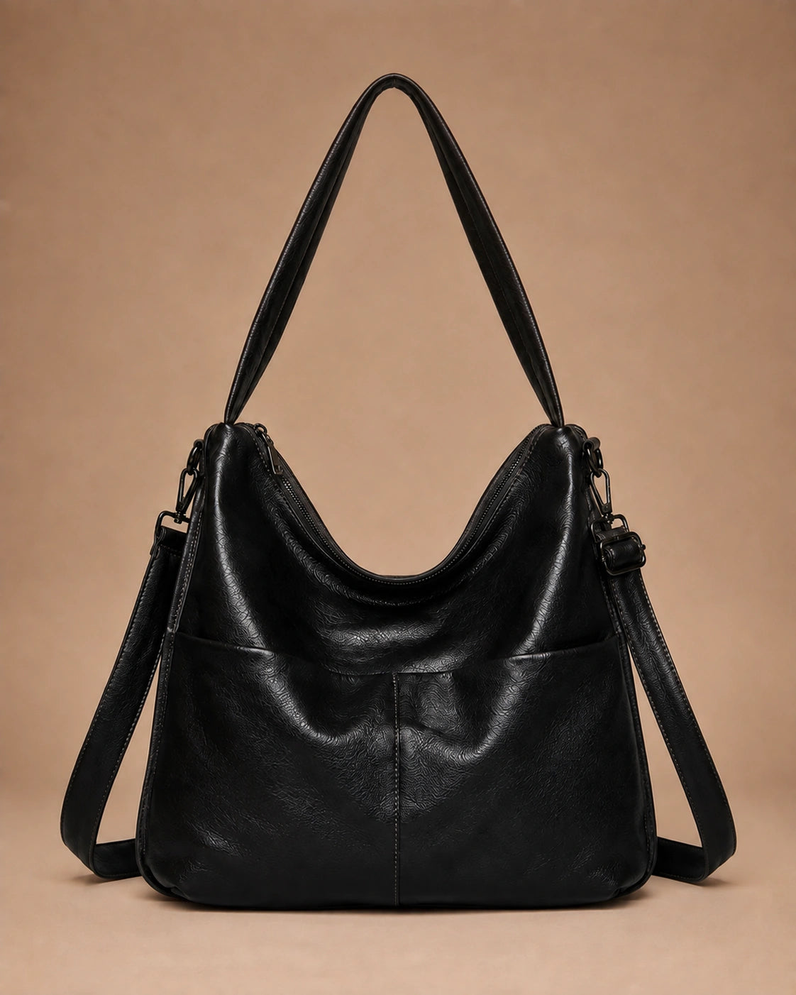 Detail view of the Marlowe genuine leather crossbody bag showing the zip closure.