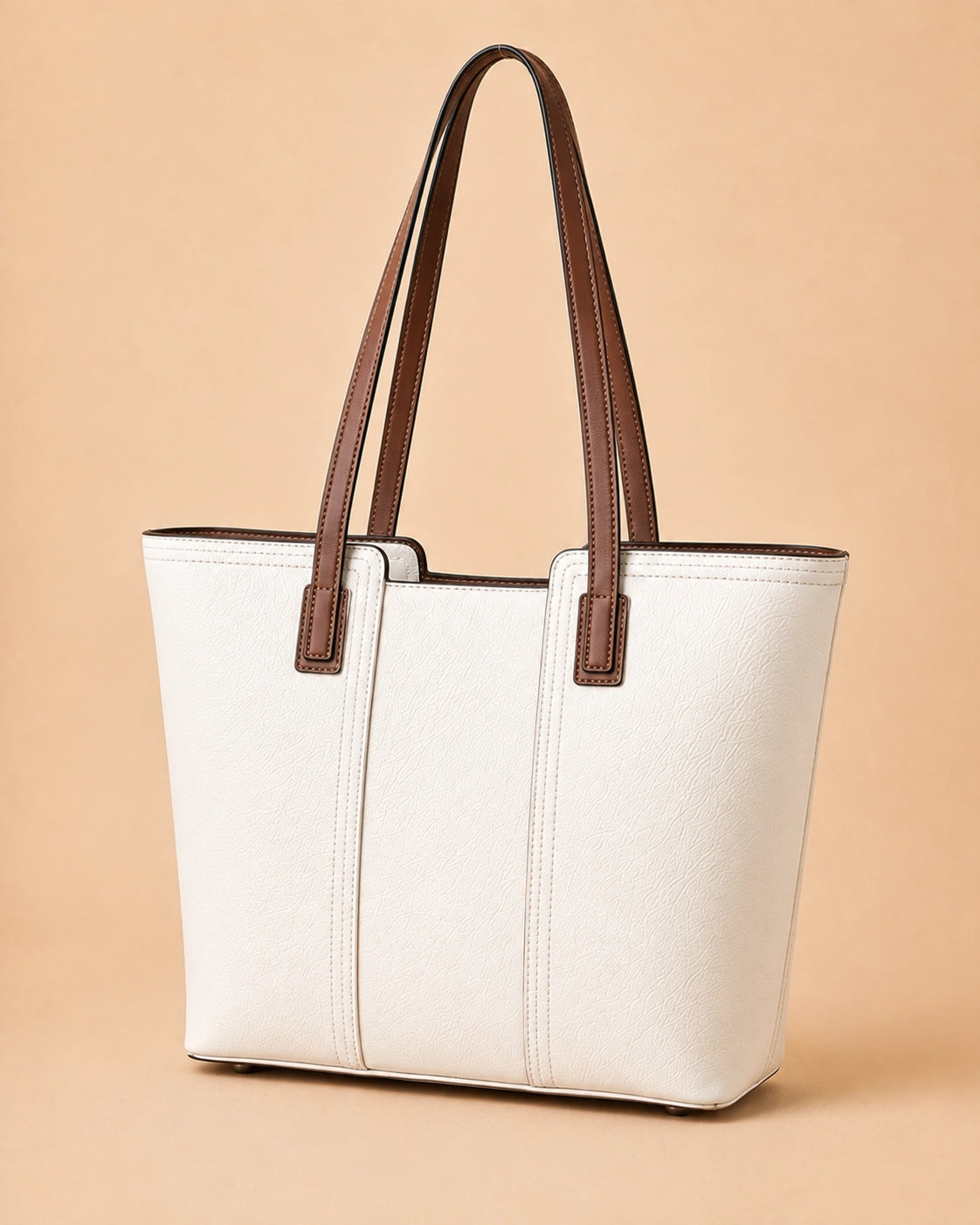 Detail view of the Sienna genuine leather tote bag showing the secure zip closure.