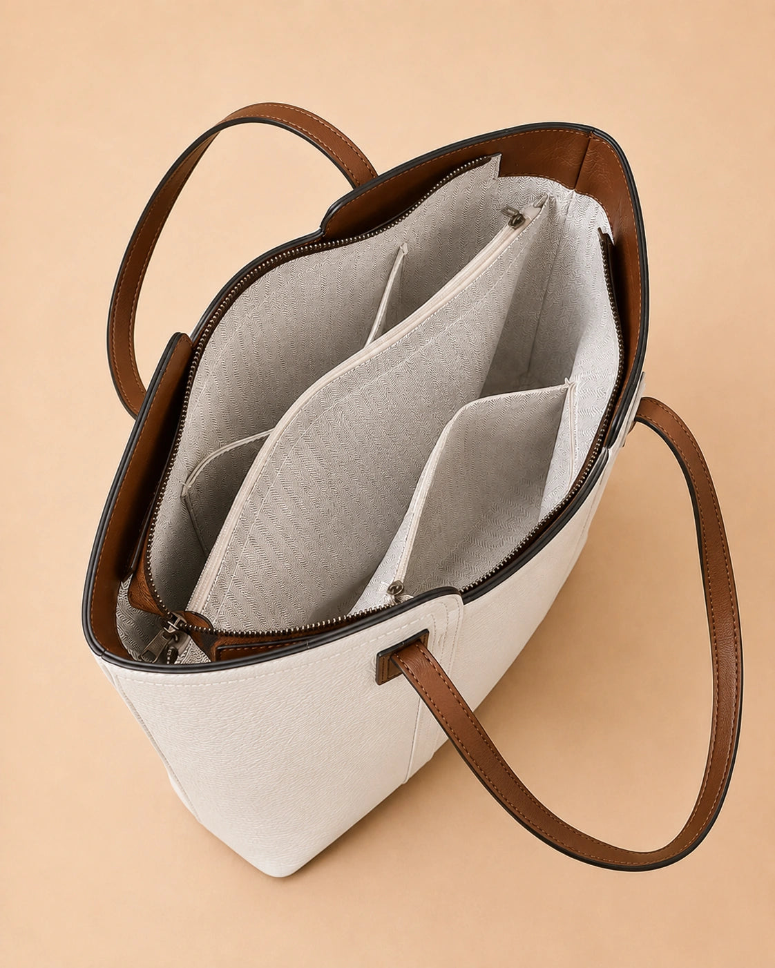 Base detail of the Sienna genuine leather tote bag showing the structured construction.