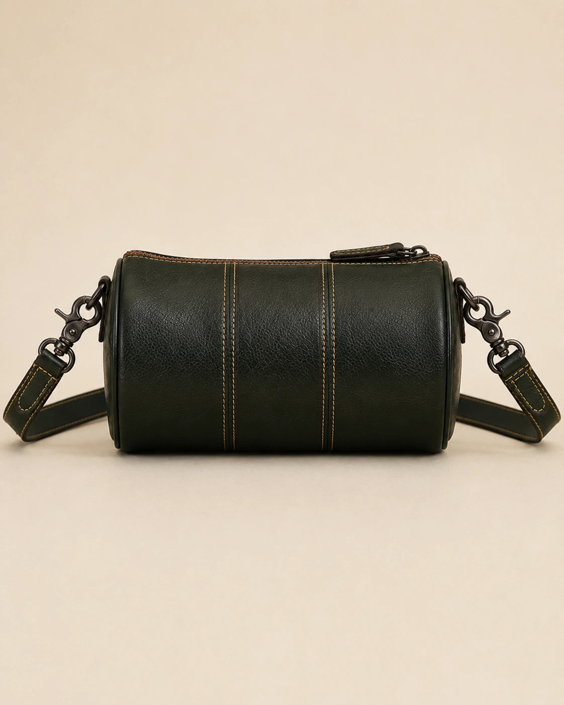 Base detail of the Romy genuine leather barrel bag showing the structured construction.