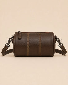 Side view of the Romy genuine leather barrel bag in an alternative colourway