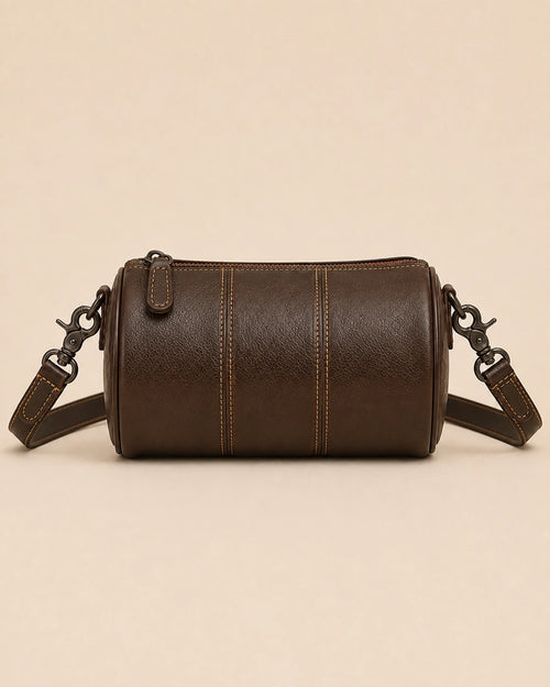 Side view of the Romy genuine leather barrel bag in an alternative colourway