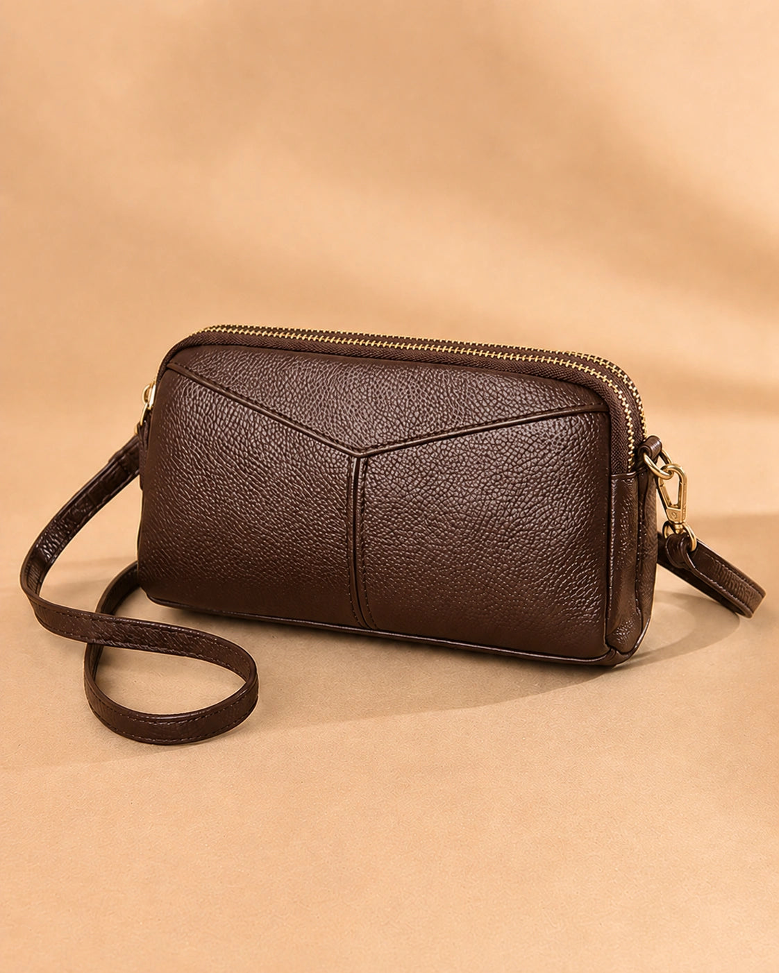 Etta small leather crossbody bag shown from the back.