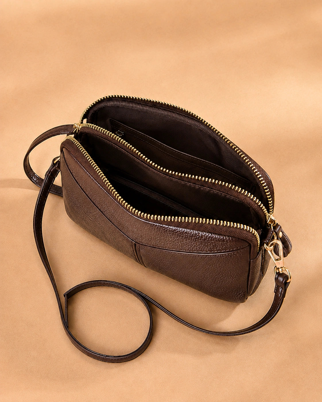 Detail view of the Etta leather crossbody bag's chain strap.