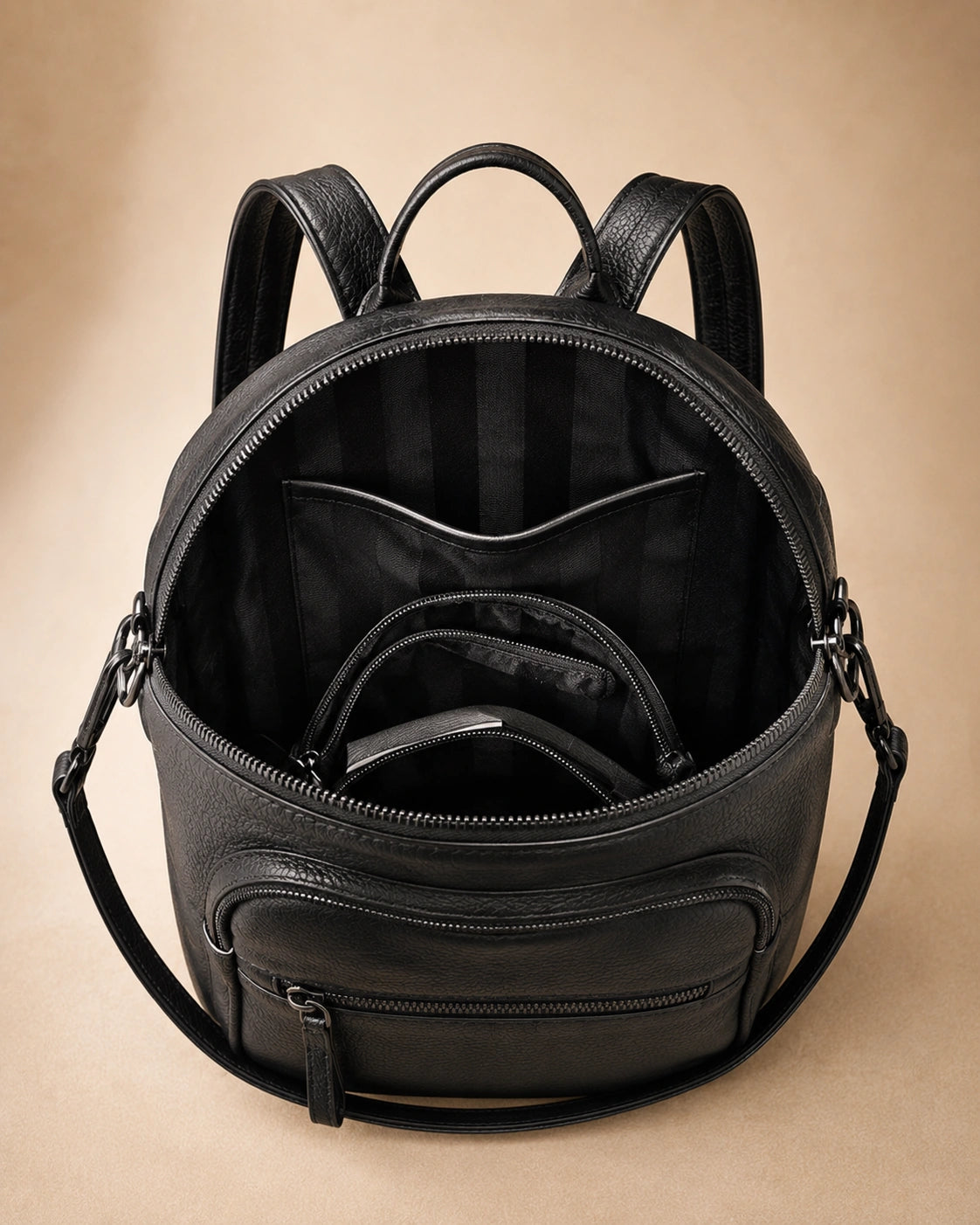 Interior view of the Isla lightweight genuine leather travel backpack in black showing the lined compartment