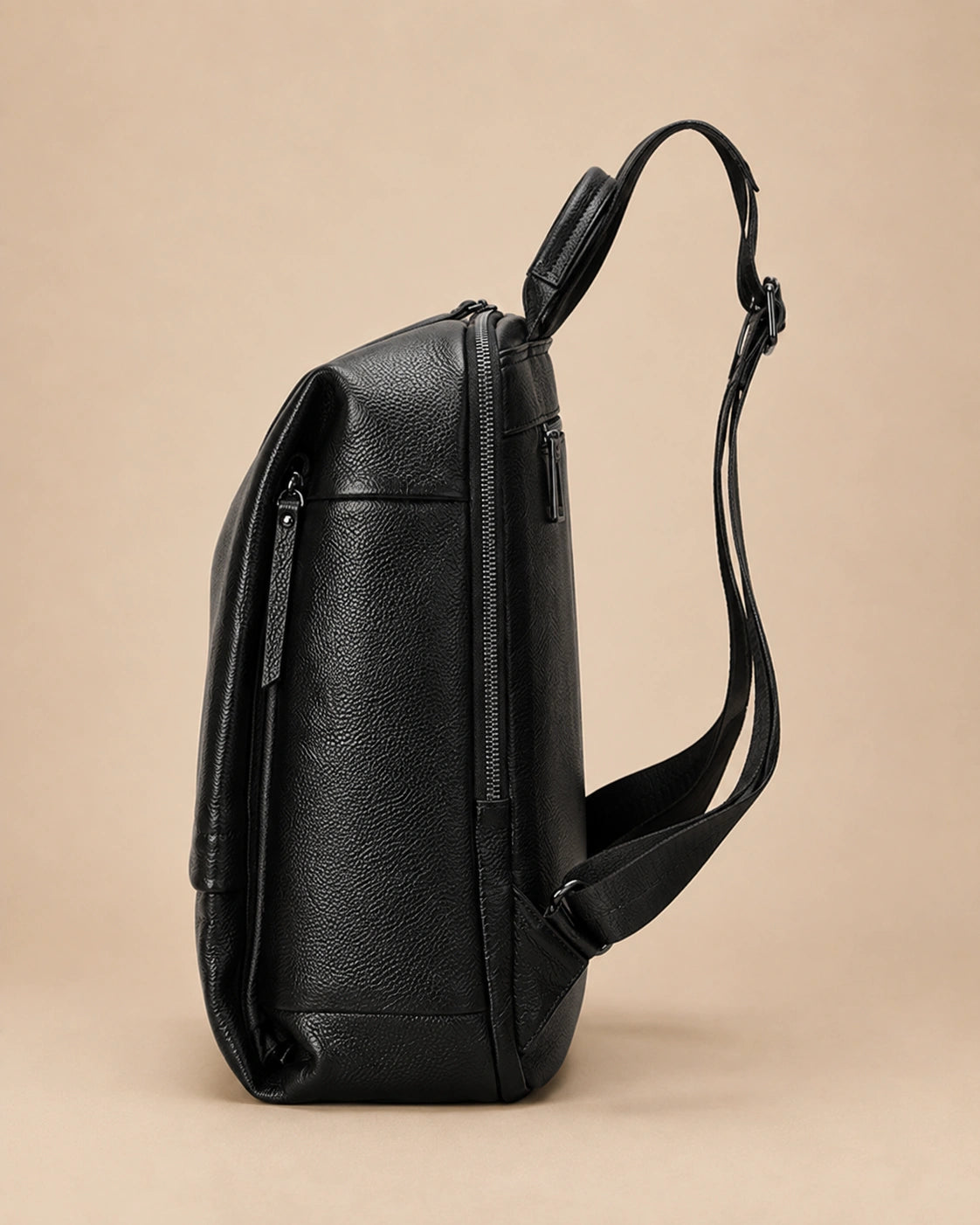 Side view of the Cecily genuine leather backpack with laptop pocket in black