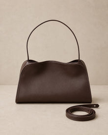 Front view of the Corinne genuine leather commuter handbag in coffee with the shoulder strap detached