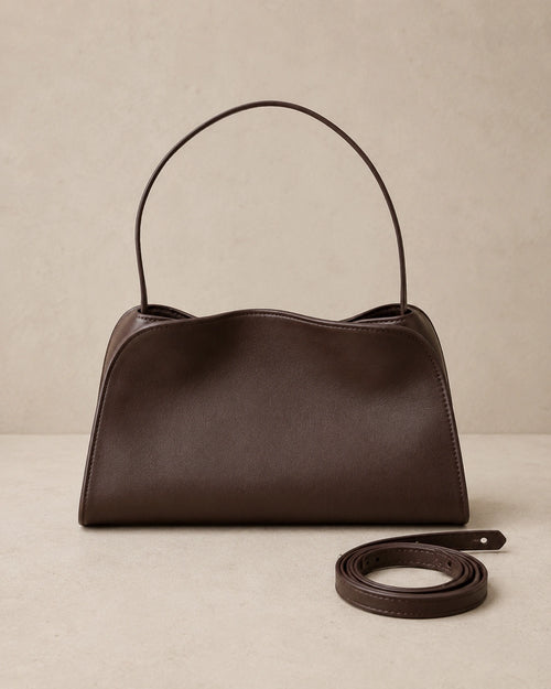 Front view of the Corinne genuine leather commuter handbag in coffee with the shoulder strap detached