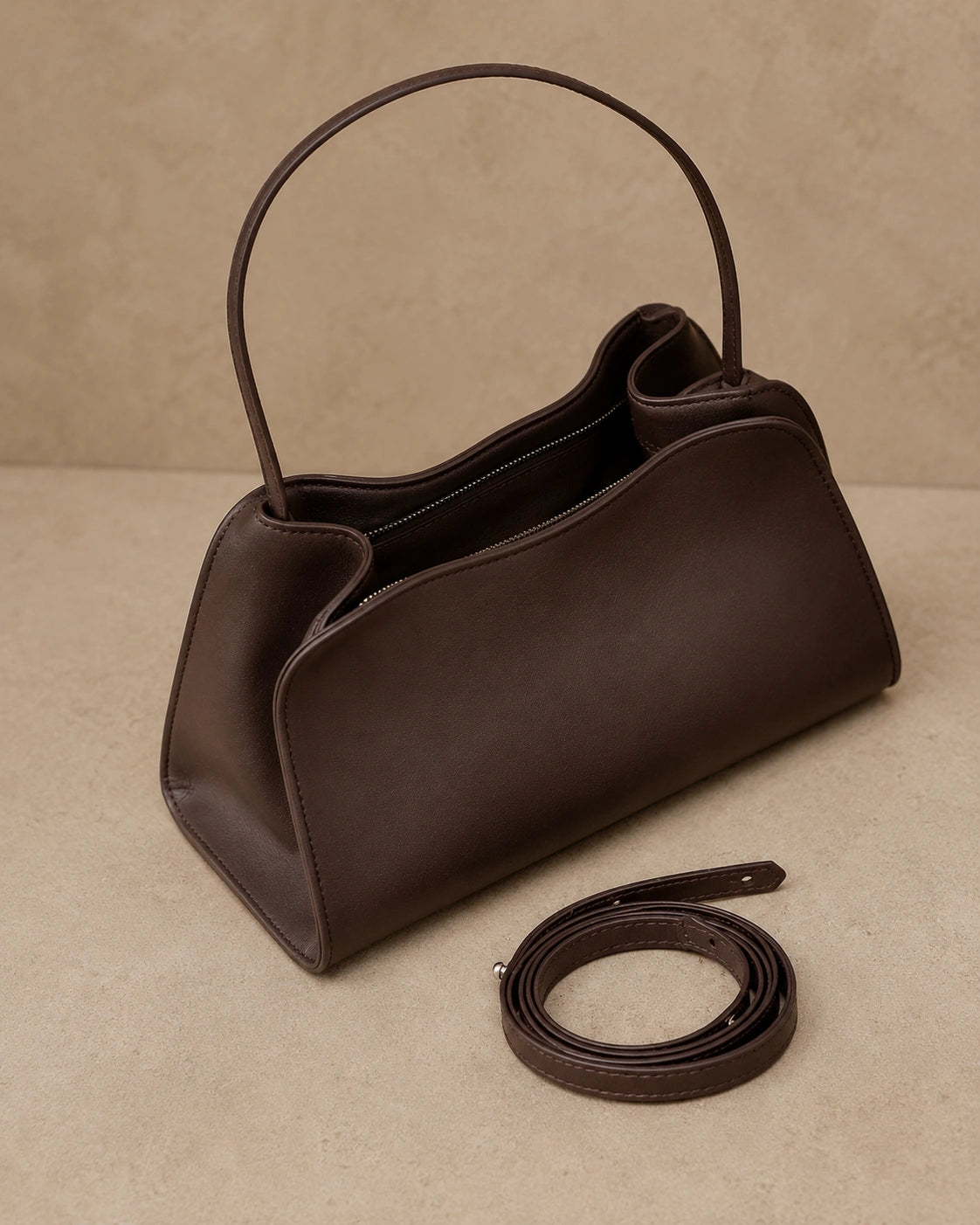 Front view of the Corinne genuine leather commuter handbag in coffee with the top open