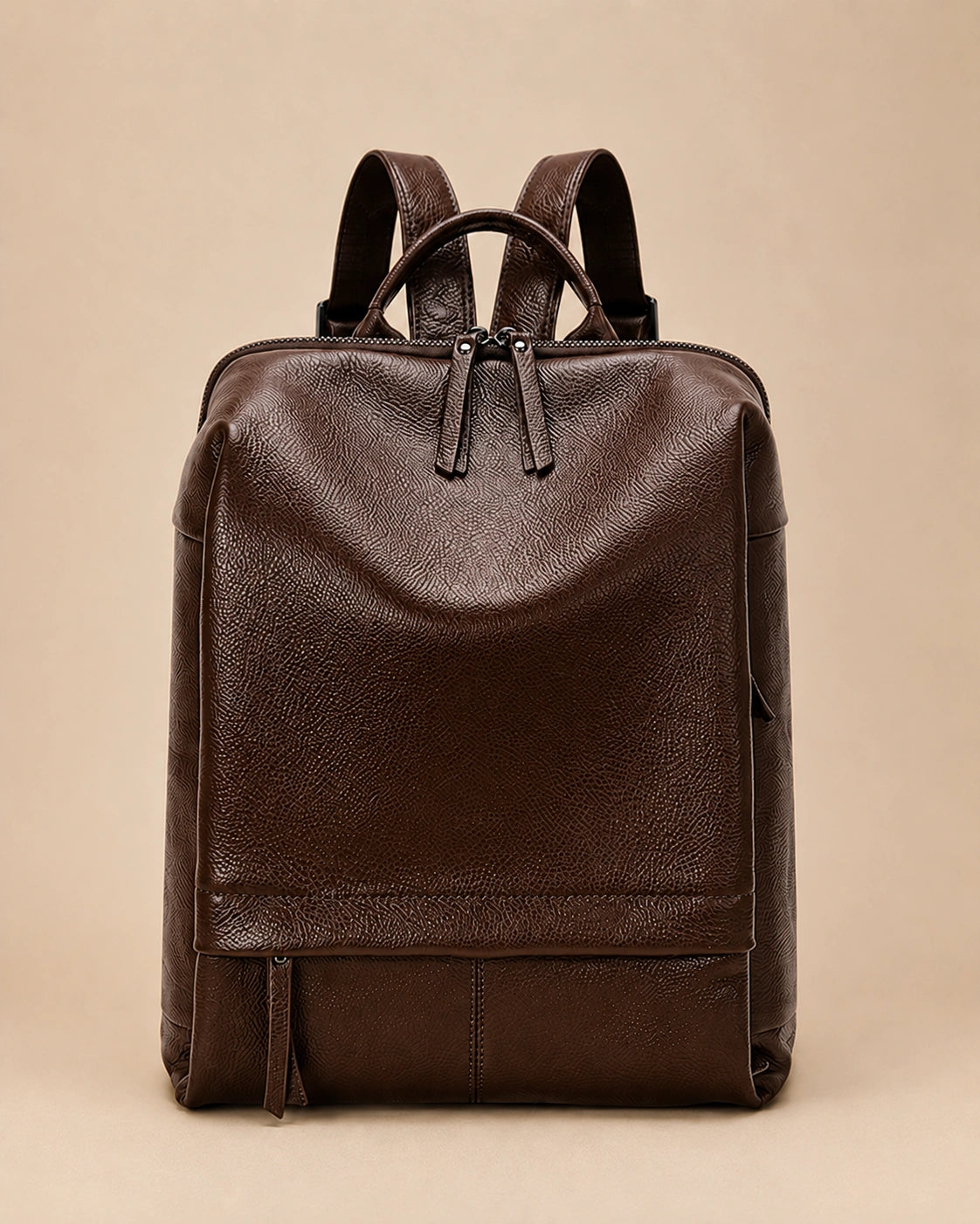 Front view of the Cecily genuine leather backpack with laptop pocket in brown