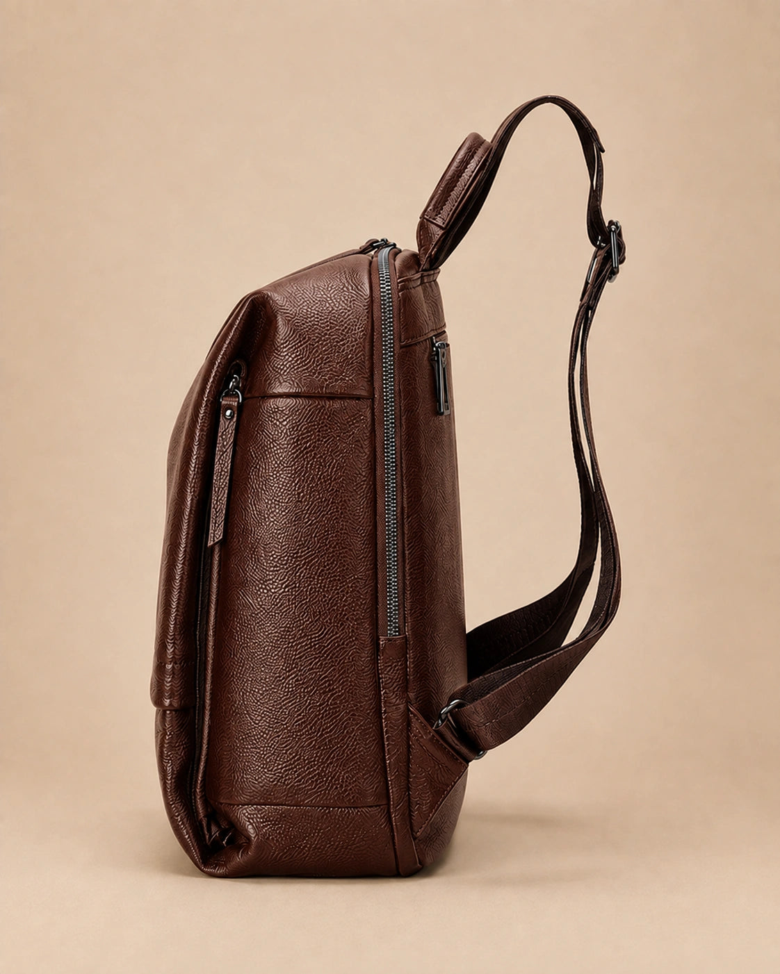 Side view of the Cecily genuine leather backpack with laptop pocket in brown