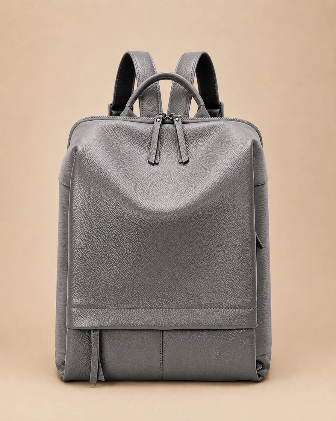 Front view of the Cecily genuine leather backpack with laptop pocket in grey
