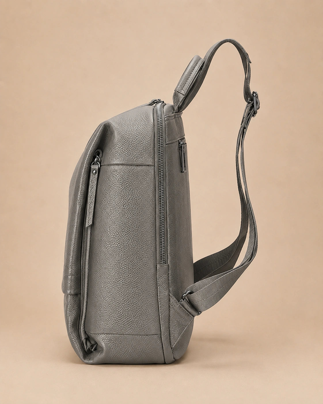 Side view of the Cecily genuine leather backpack with laptop pocket in grey
