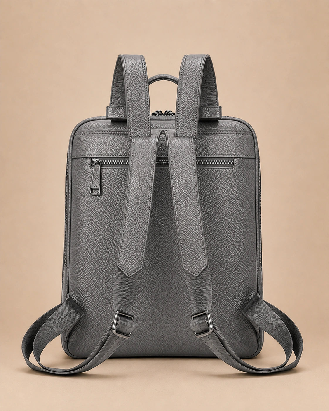 Back view of the Cecily genuine leather backpack with laptop pocket in grey showing the adjustable straps