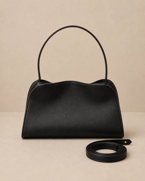 Front view of the Corinne genuine leather commuter handbag in black showing the top handle