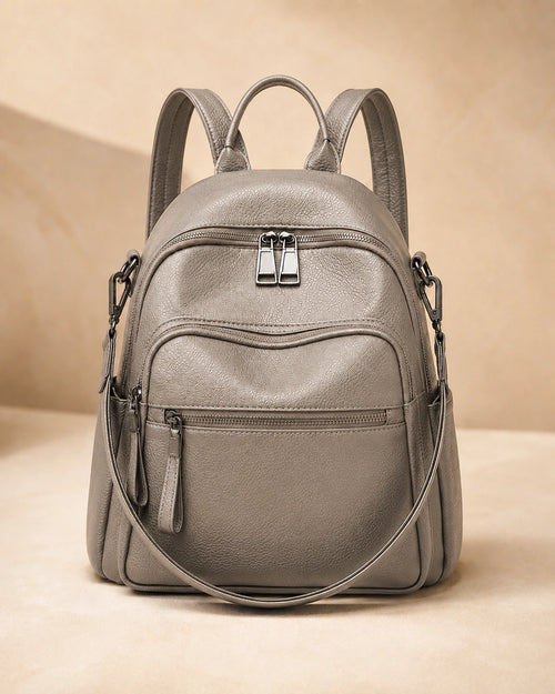Front view of the Isla lightweight genuine leather travel backpack in grey