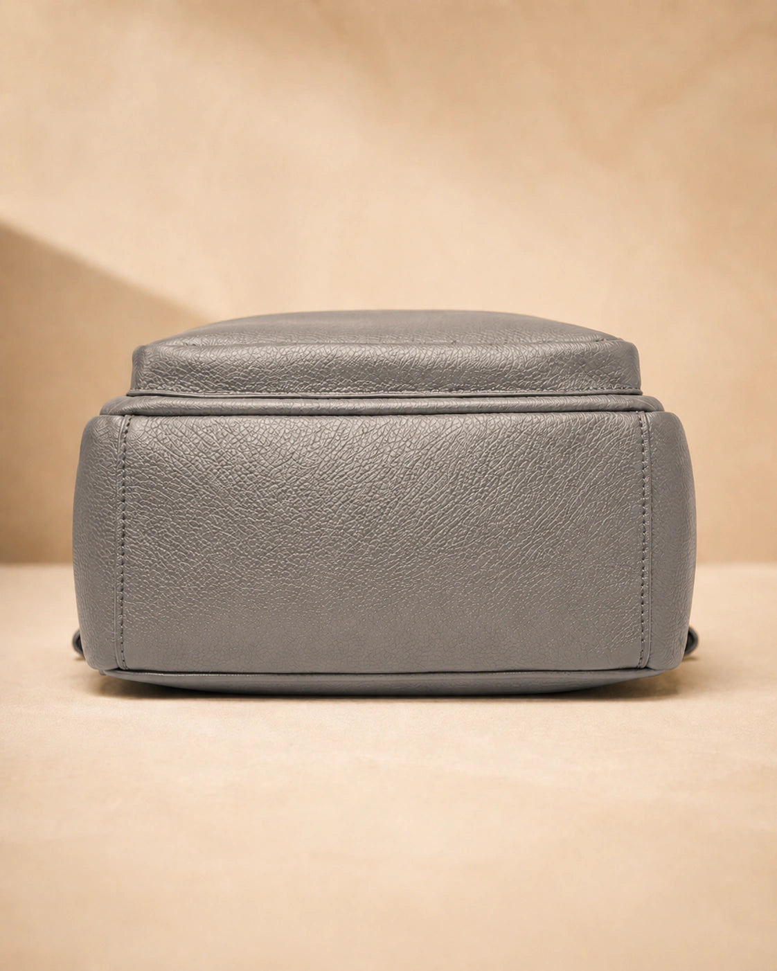 Base view of the Isla lightweight genuine leather travel backpack in grey