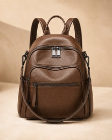 Front view of the Isla lightweight genuine leather travel backpack in brown
