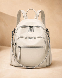 Front view of the Isla lightweight genuine leather travel backpack in off-white