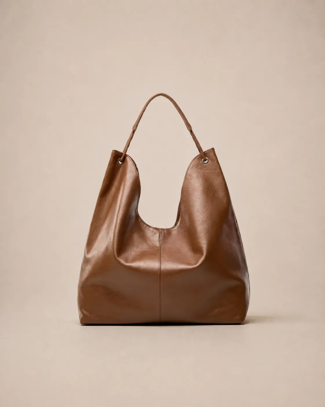 Front view of the Colette leather hobo tote bag in brown featuring a soft silhouette and spacious interior for everyday use.