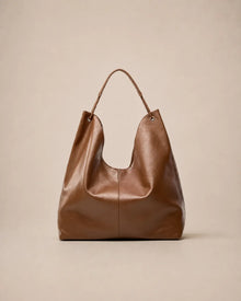 Front view of the Colette leather hobo tote bag in brown featuring a soft silhouette and spacious interior for everyday use.